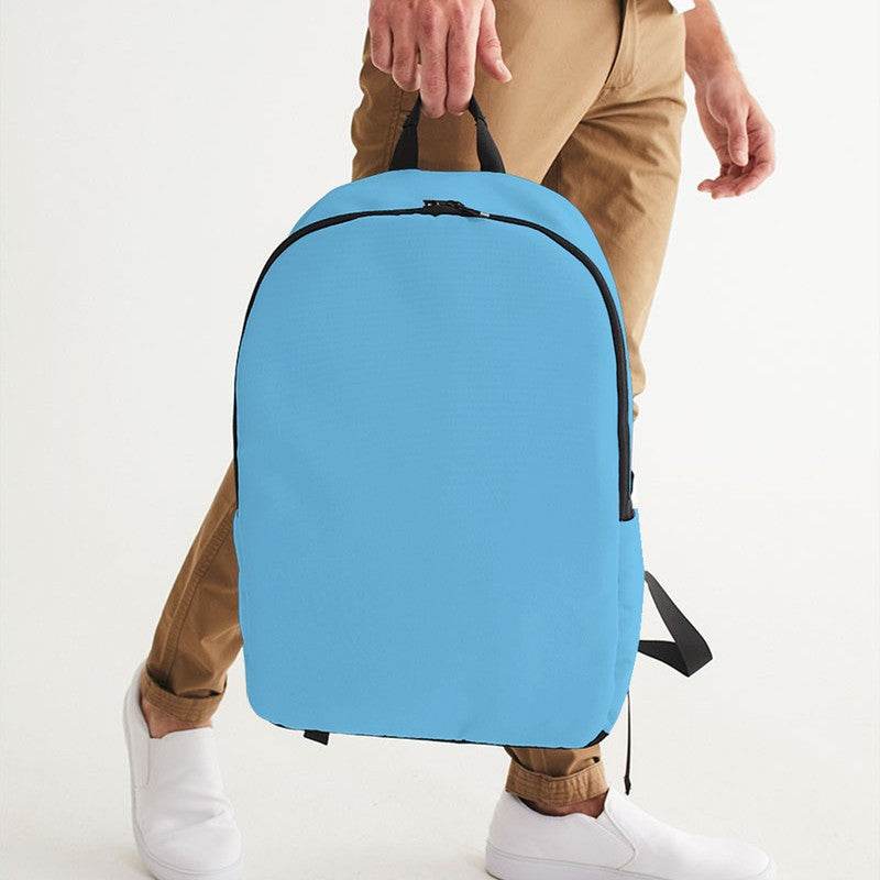 Medium-Light Medium Cyan Waterproof Backpack (BC1-ME-ML) - Man Holding CloseUp