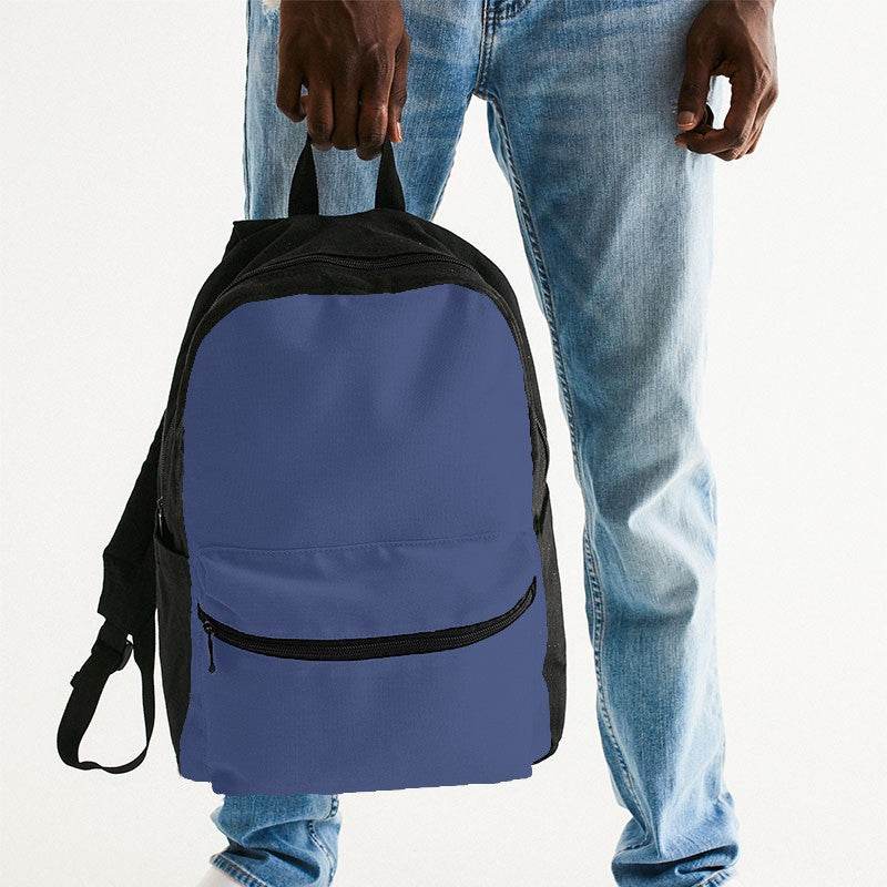 Medium Muted Indigo Canvas Backpack (I-MU-ME) - Man Holding