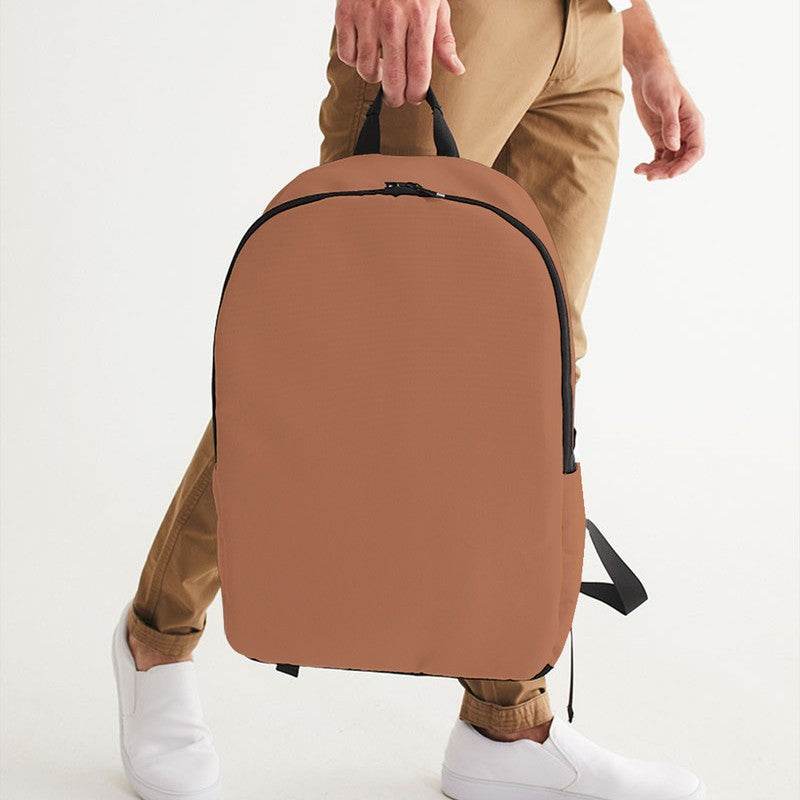 Medium Muted Orange Waterproof Backpack (OR2-MU-ME) - Man Holding CloseUp